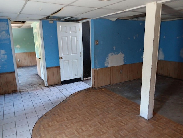 interior space featuring wood walls