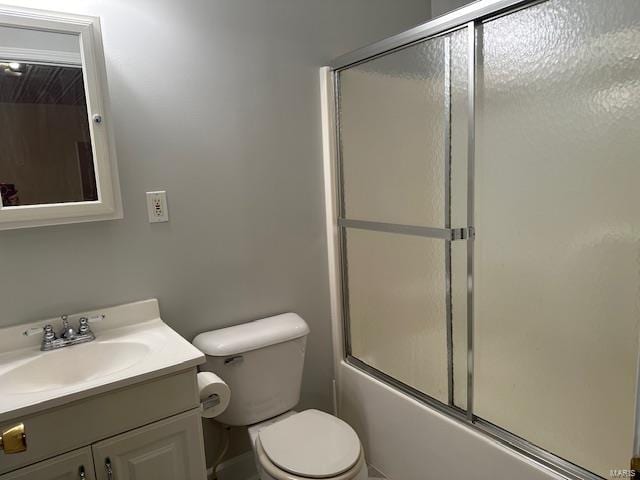 full bathroom featuring vanity, toilet, and enclosed tub / shower combo