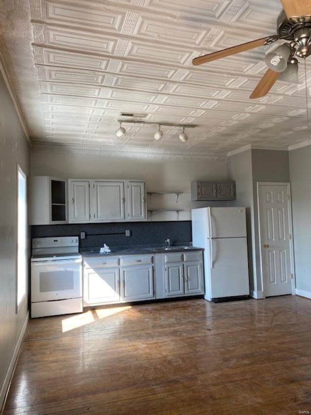 kitchen with ceiling fan, dark hardwood / wood-style flooring, and white appliances