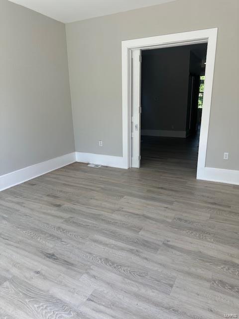 spare room featuring light hardwood / wood-style flooring