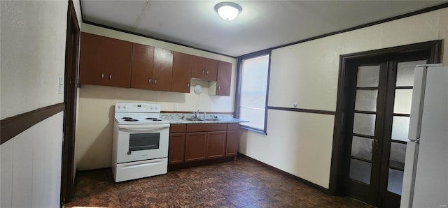 kitchen featuring white appliances and sink