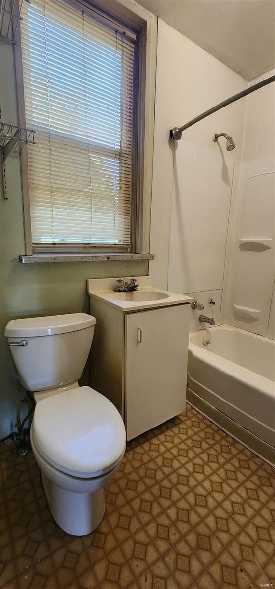 full bathroom with shower / tub combination, vanity, and toilet