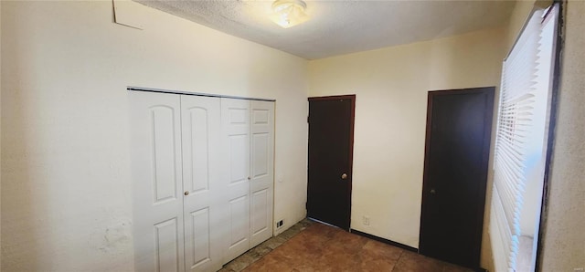 unfurnished bedroom with a closet