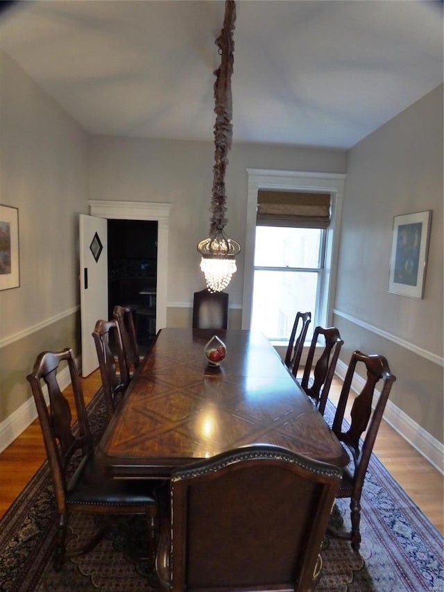 dining area with wood-type flooring