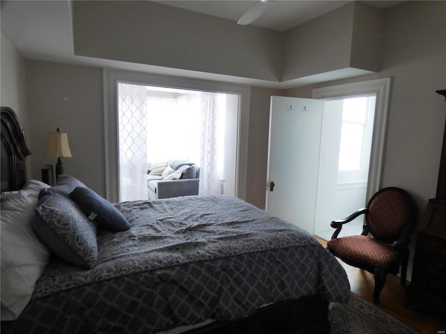 bedroom featuring multiple windows and ceiling fan