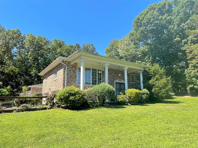 view of home's exterior with a yard