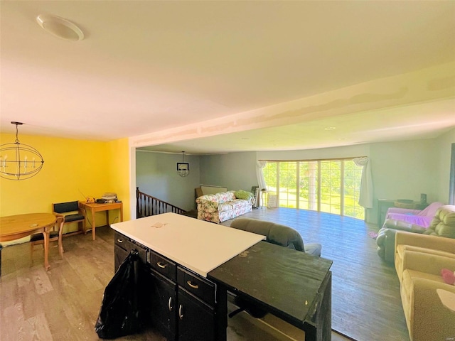 interior space featuring a chandelier, decorative light fixtures, and light hardwood / wood-style floors