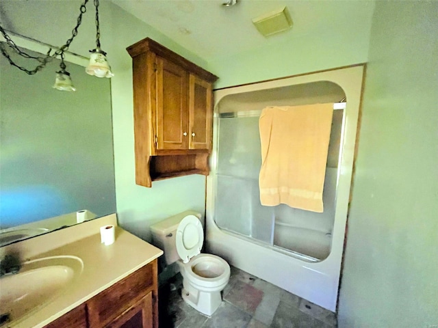 full bathroom featuring toilet, combined bath / shower with glass door, and vanity