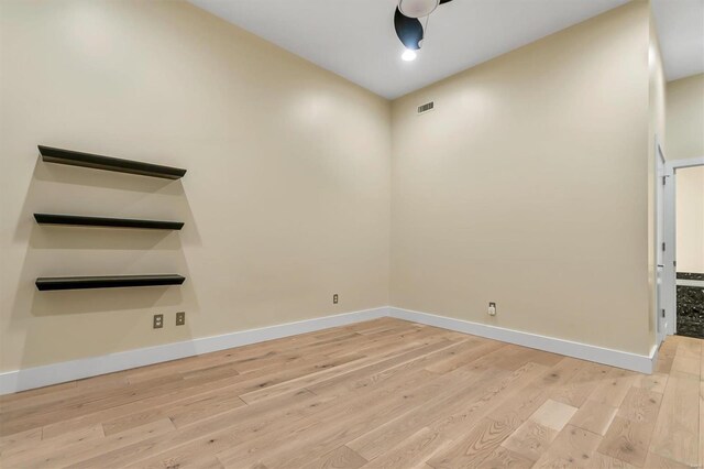 empty room with light hardwood / wood-style floors