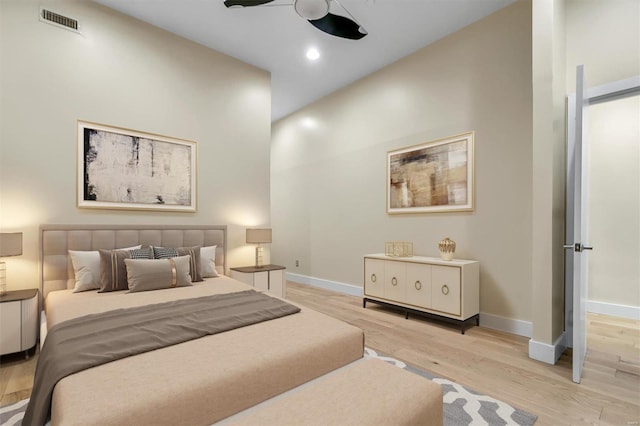 bedroom featuring light hardwood / wood-style floors and ceiling fan