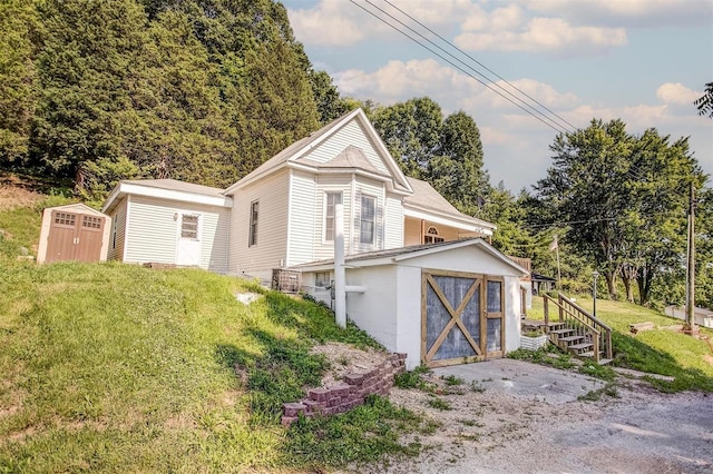 view of property exterior featuring a storage unit