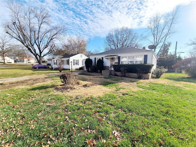 single story home featuring a front yard