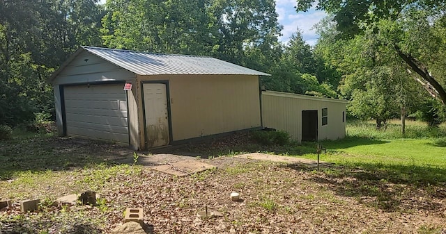 garage with a yard