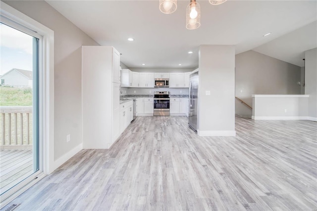 kitchen with white cabinetry, a healthy amount of sunlight, light hardwood / wood-style flooring, and appliances with stainless steel finishes