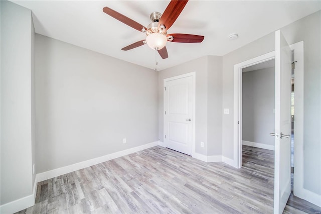 unfurnished bedroom with wood-type flooring and ceiling fan