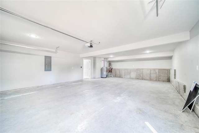 garage featuring gas water heater, electric panel, and a garage door opener