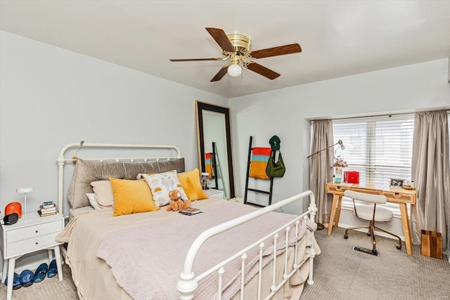 bedroom featuring light carpet and ceiling fan