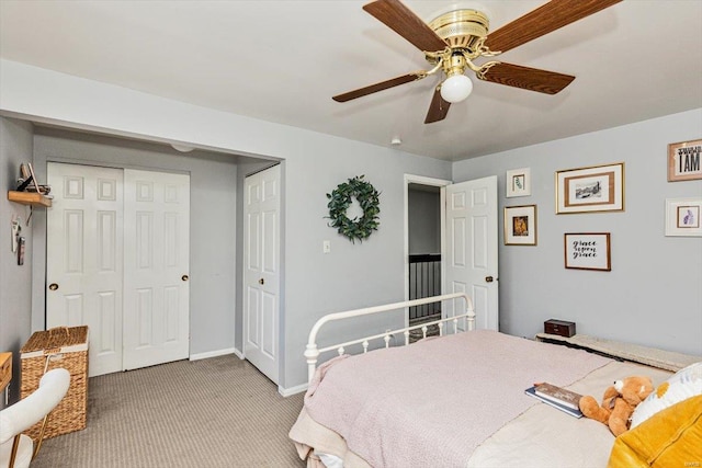 carpeted bedroom featuring a closet and ceiling fan