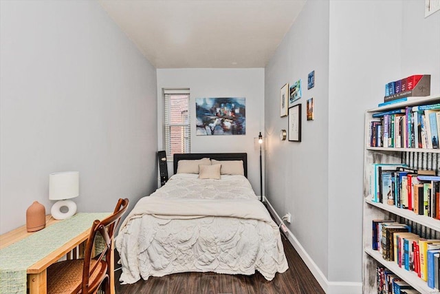 bedroom with dark wood-type flooring