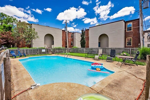 view of swimming pool featuring a patio