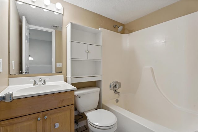 full bathroom with vanity, toilet, a textured ceiling, and bathtub / shower combination