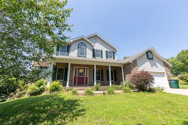 view of front of house with a garage, a front yard, and a porch