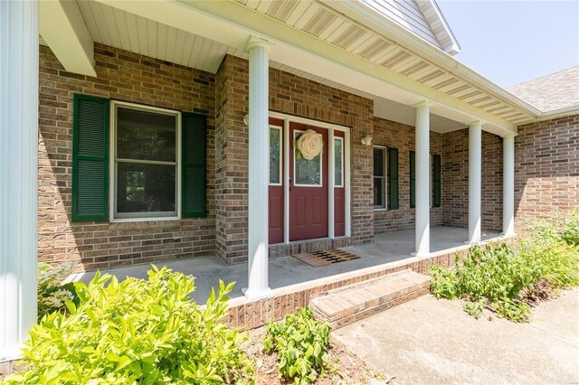 property entrance featuring covered porch