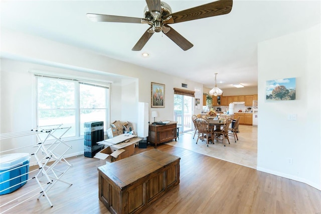 living room featuring ceiling fan and light tile flooring