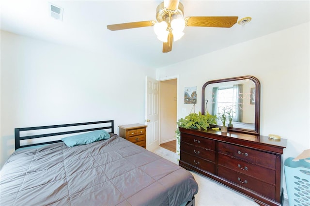 bedroom featuring light hardwood / wood-style floors and ceiling fan