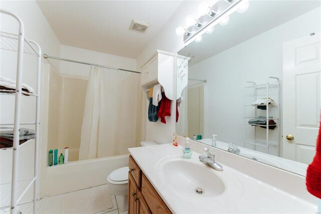 full bathroom with shower / tub combo, tile flooring, toilet, and large vanity