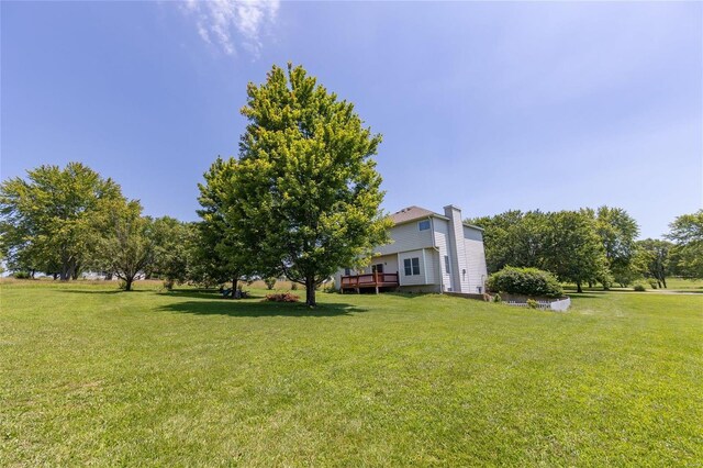 view of yard with a wooden deck