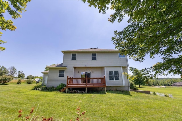 back of house with a yard and a deck