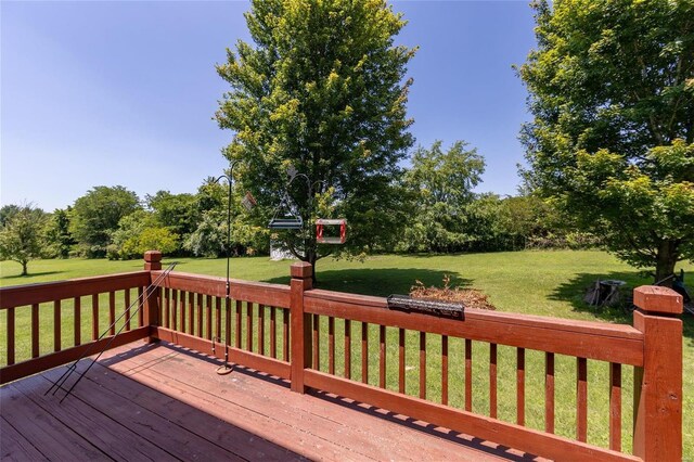 wooden terrace with a yard