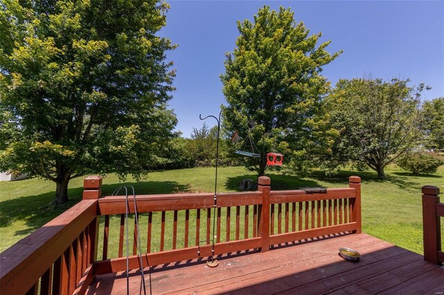 wooden terrace with a yard