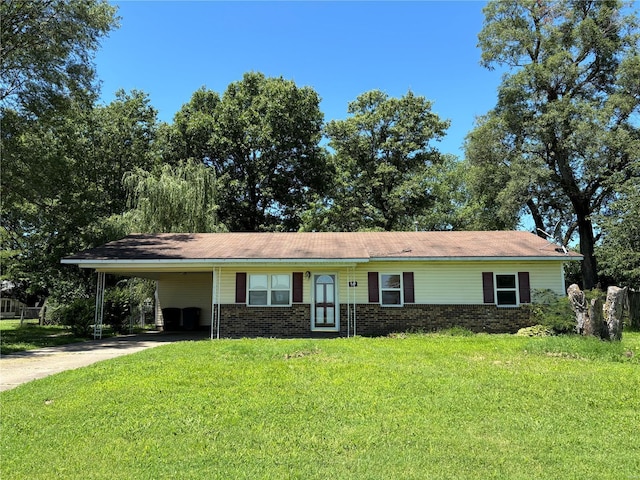 ranch-style house with a front lawn and a carport