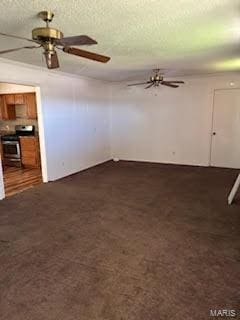 unfurnished living room with dark carpet, a textured ceiling, and ceiling fan