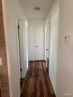 hallway featuring dark hardwood / wood-style floors