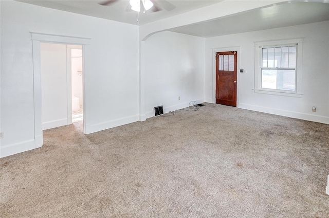 spare room with light colored carpet and ceiling fan