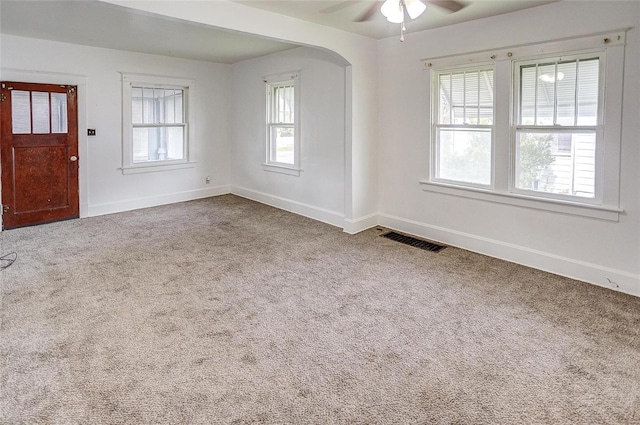 spare room with carpet floors and ceiling fan