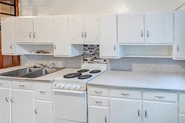 kitchen featuring white cabinets, white electric range, decorative backsplash, and sink