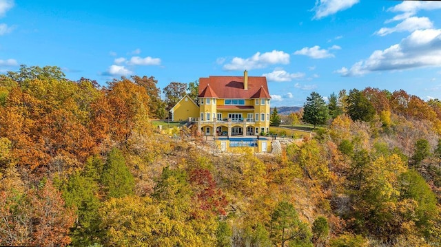 rear view of property with a balcony