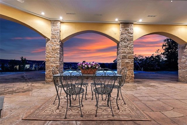 view of patio terrace at dusk