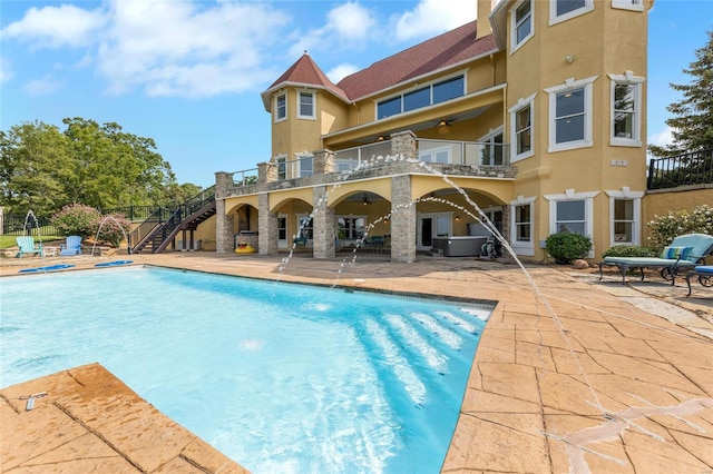 view of swimming pool featuring a patio, an in ground hot tub, and ceiling fan