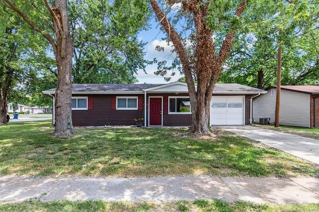 ranch-style home with central AC, a front lawn, and a garage