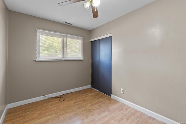 unfurnished room featuring ceiling fan and light hardwood / wood-style flooring