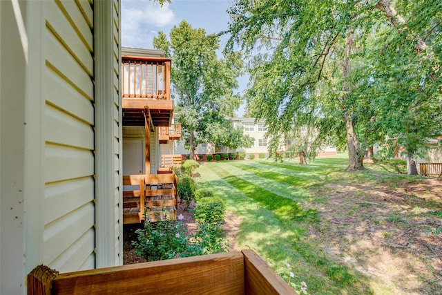 view of yard featuring a wooden deck