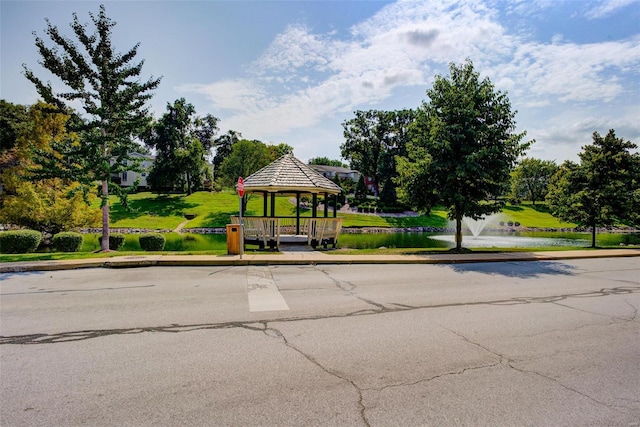 view of front of home featuring a water view and a gazebo