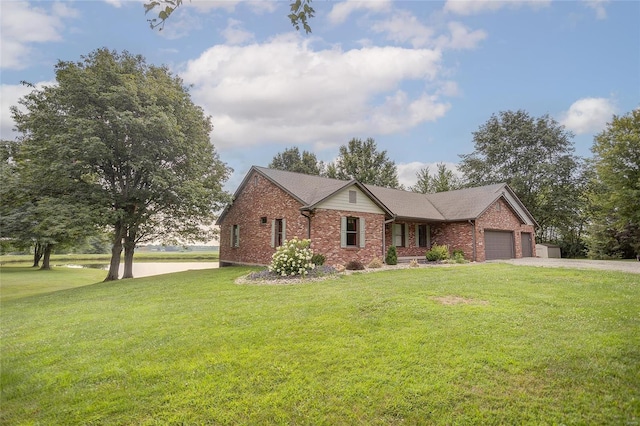 view of front of house with a front lawn and a garage