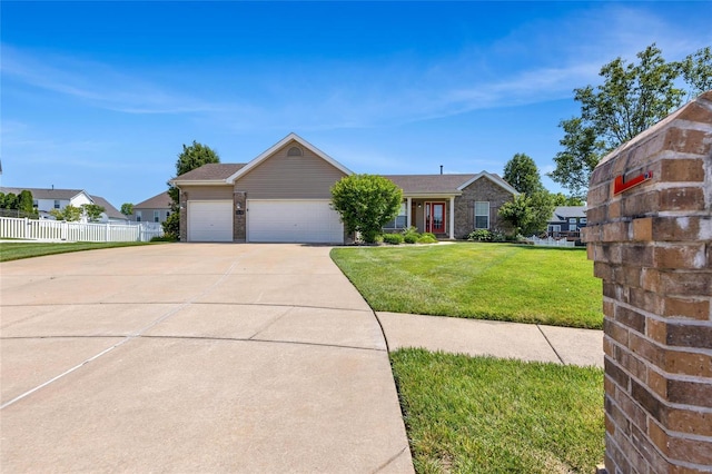 ranch-style home with a front yard and a garage