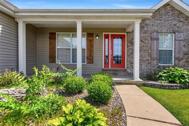 property entrance featuring covered porch